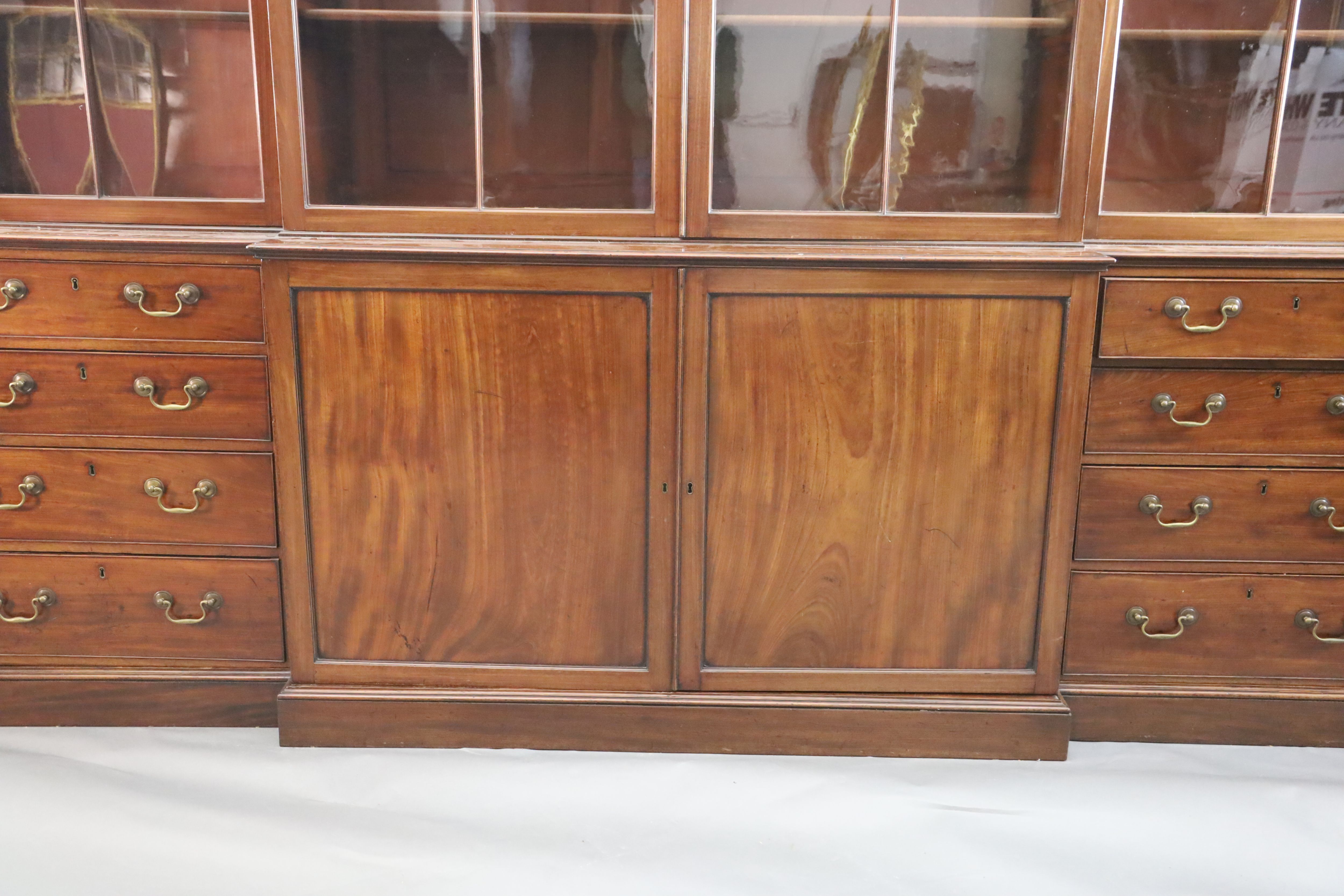 A George III mahogany breakfront library bookcase, W.11ft 5in. D.1ft 10in. H.9ft